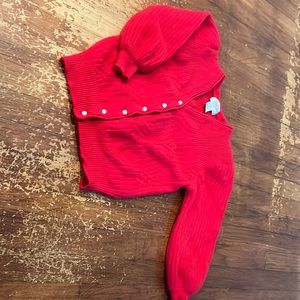 Vintage cardigan. Red “pearl” buttons. 70% Lambswool 20% Angora 10% Nylon